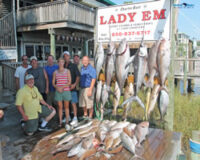posing with fish in destin